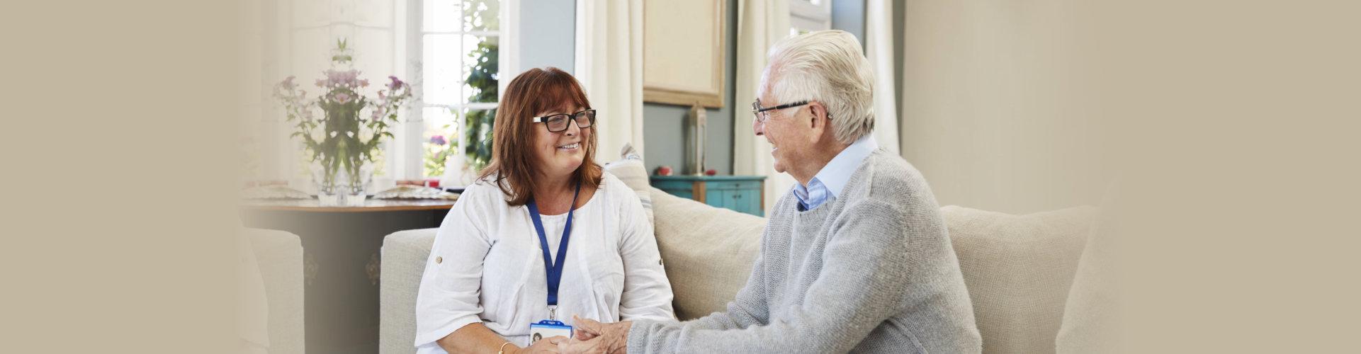 elderly man talking to a woman