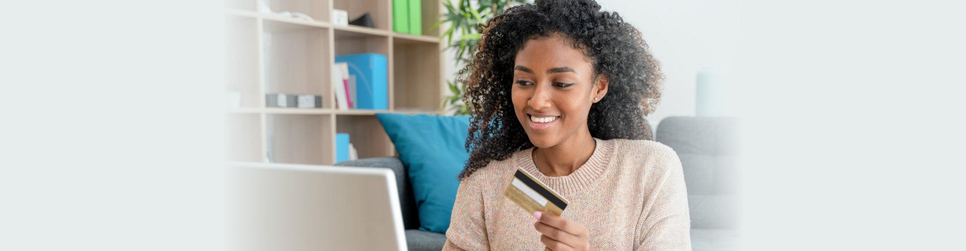 a woman paying using her card